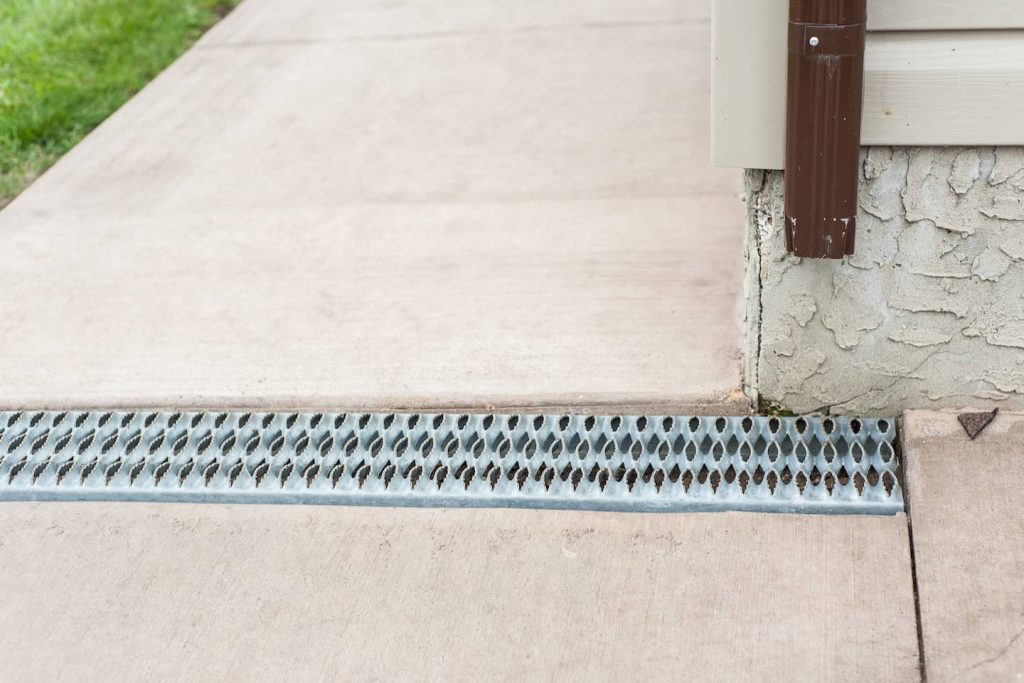 A great accessibility idea, the eavestrough flows underneath a grate in the sidewalk so there is no need to maneuver around downspouts.
