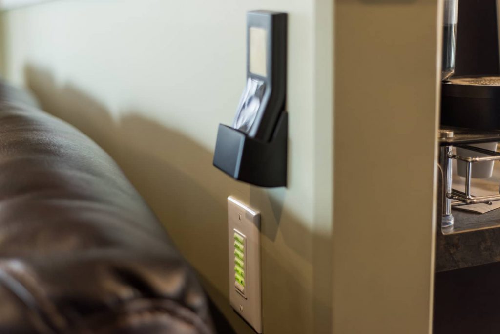 Remote wall switches for fireplace and blinds are conveniently placed on the walls.