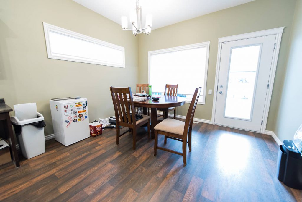 The dining room area is open to the kitchen, and is situated by the backyard entrance. Vinyl plank flooring is very durable, and easy to look after.  Window coverings are controlled remotely.