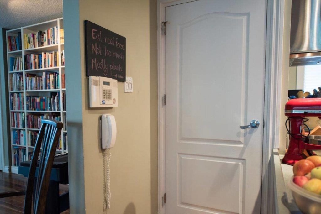The telephone and security system are set at a height that is accessible for the homeowner.